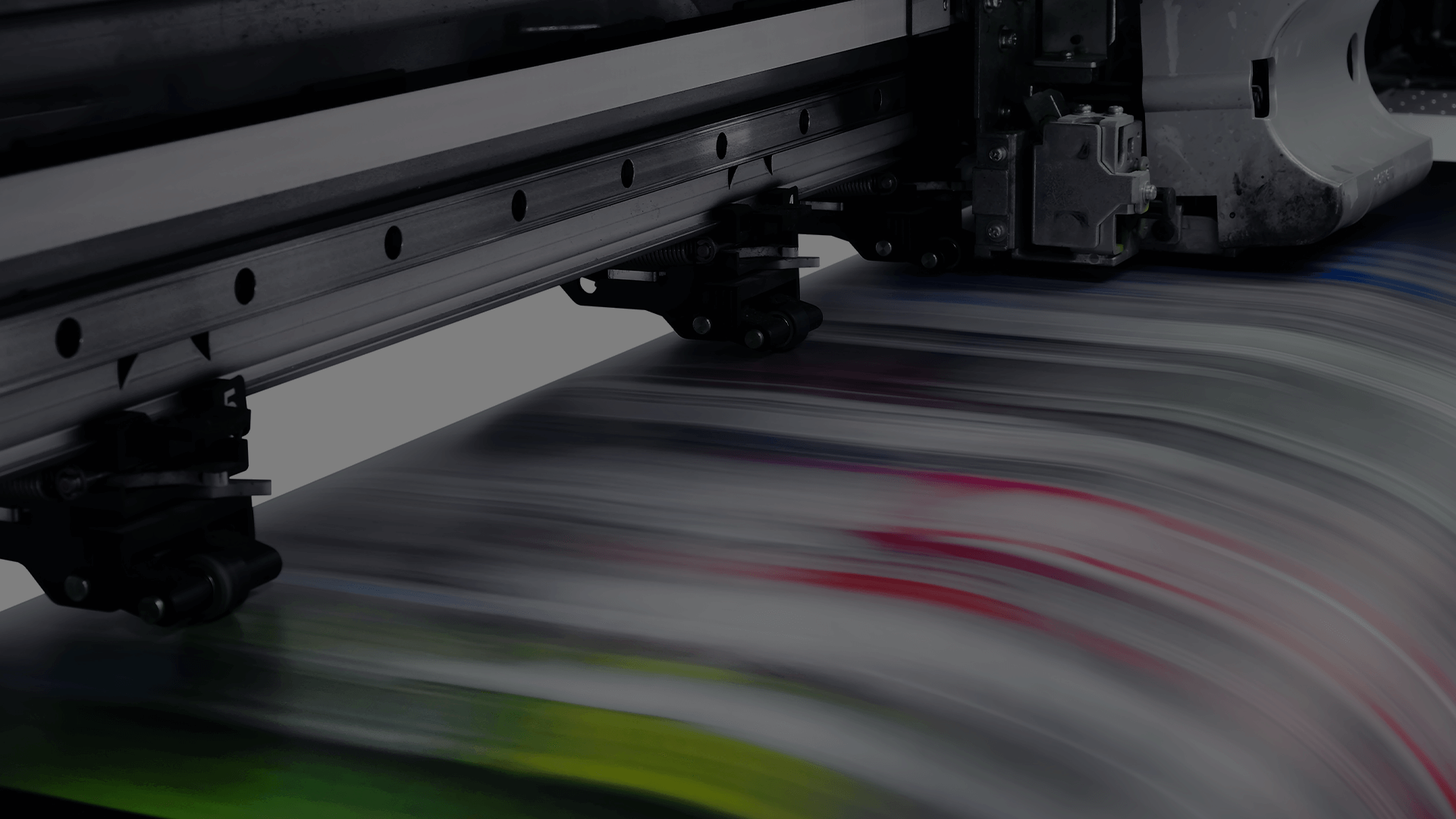 A high-speed, wide-format printer producing vibrant, colorful prints, emphasizing the capability and efficiency of advanced managed print services.