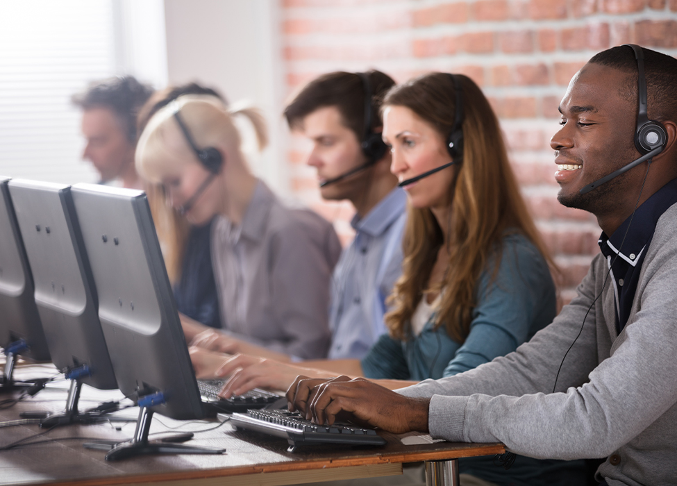 call center services | customer services reps using headsets to speak to customers