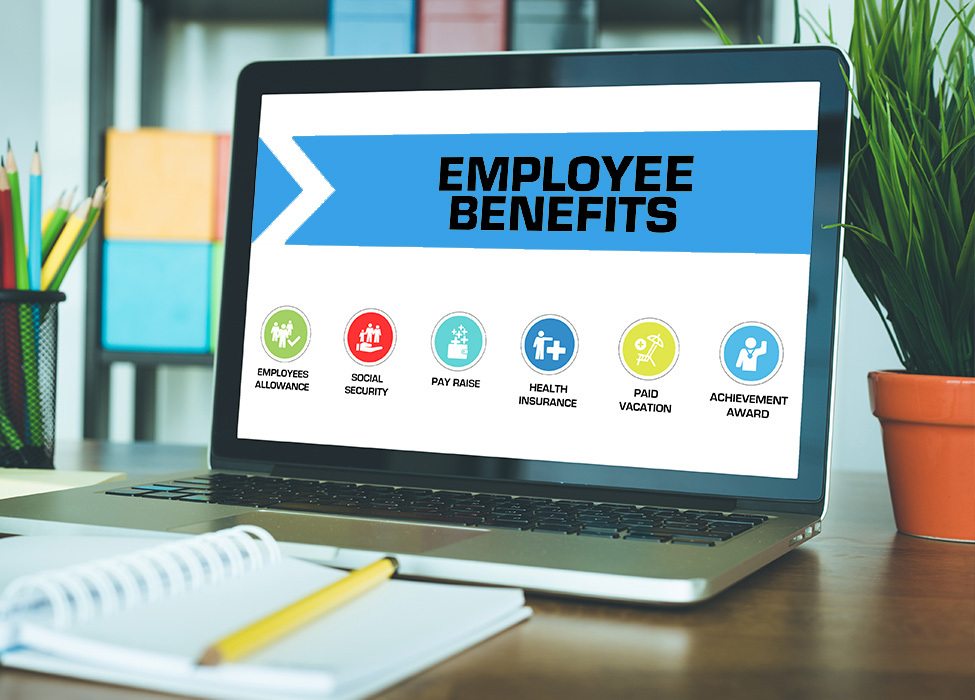 Laptop screen showing Employee Benefits including health insurance, paid vacation, achievement award, and more