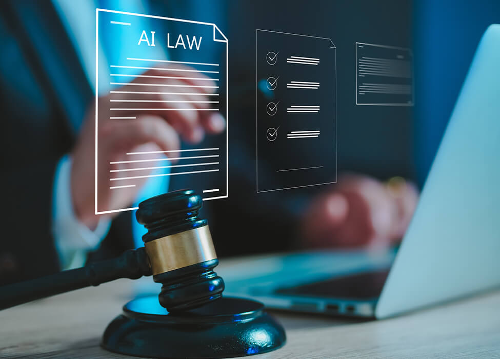 A person in a suit sitting at a desk with a laptop, a judge's gavel, and a digital overlay displaying "AI LAW" and checklist icons. This represents the integration of AI in business legal services